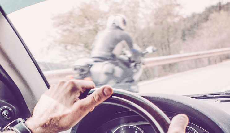 Motorcycle Next to Car