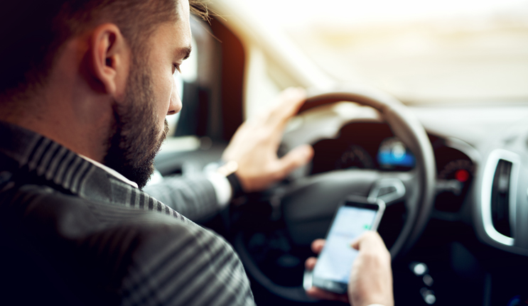 Person Driving While Using Phone