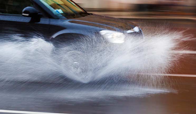 Car driving through water